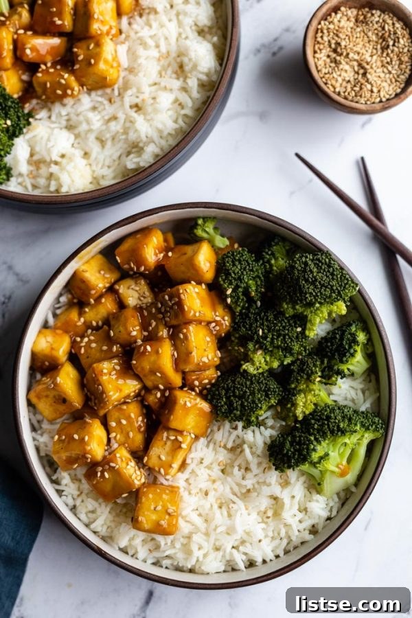 Tofu bowl with fluffy rice, perfectly cooked broccoli, and a rich sauce