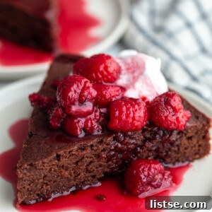 Decadent Red Wine Chocolate Cake 7 A slice of vegan red wine chocolate cake with red wine berries.