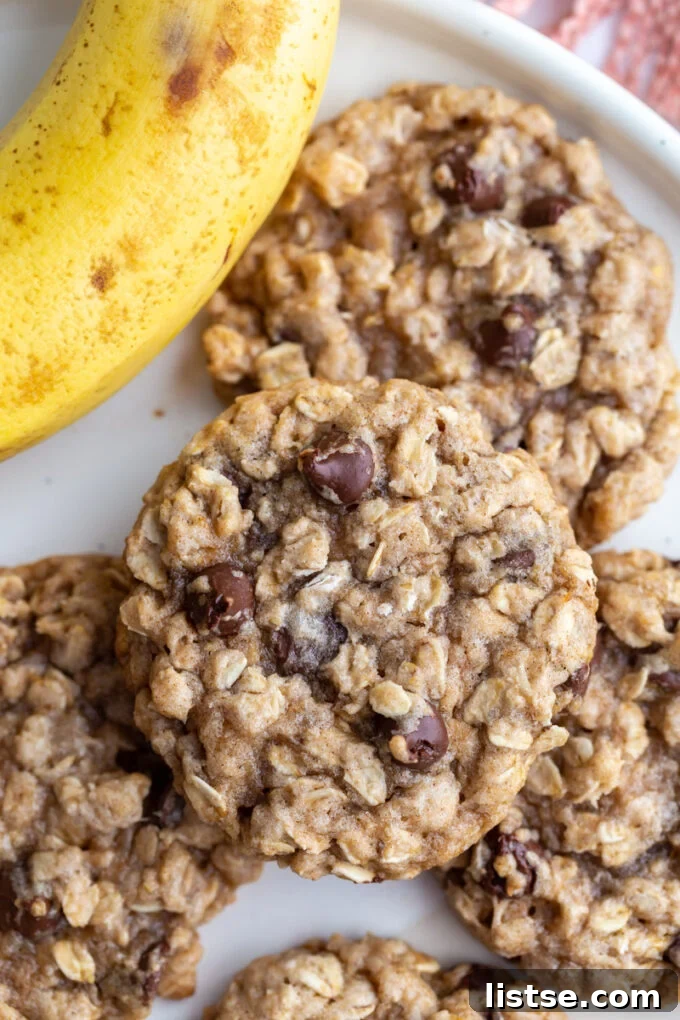 banana oatmeal cookies stacked on a white plate