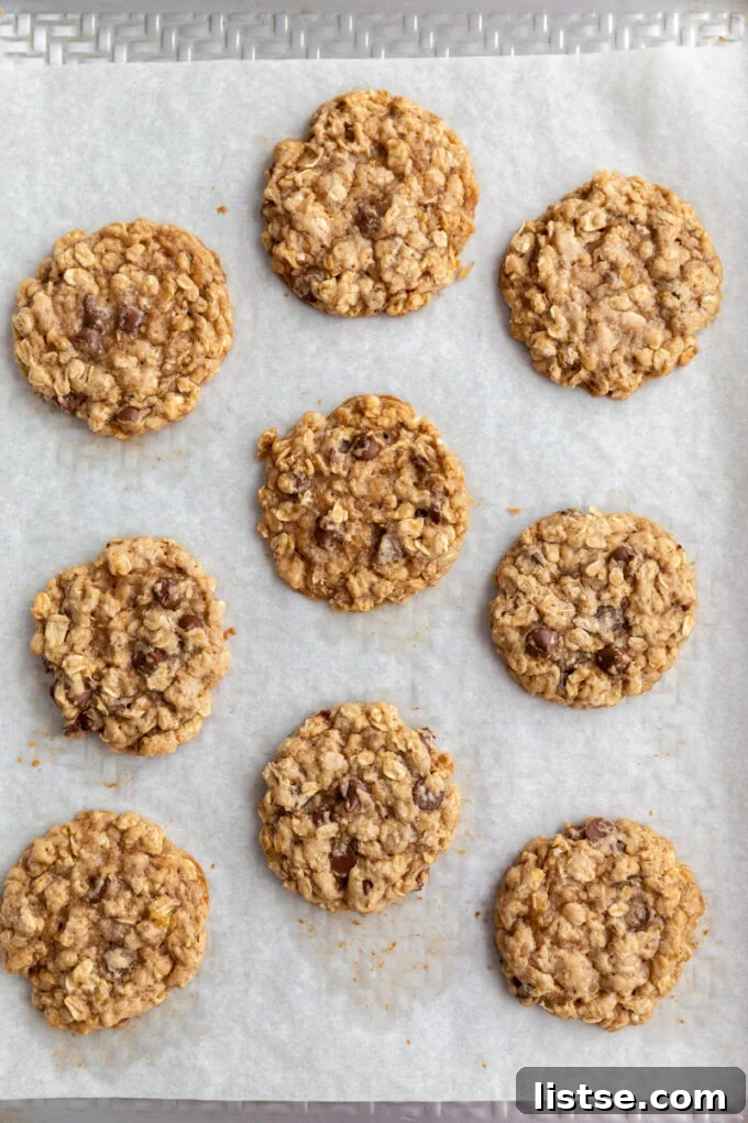 banana chocolate chips cookies on a sheet pan lined with parchment paper
