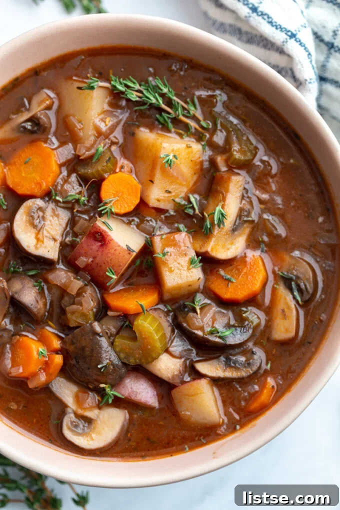 Hearty vegetable stew with potatoes and mushrooms served in a bowl