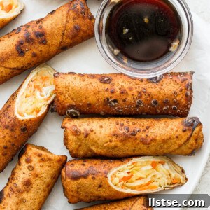 Vegan Egg Rolls on a white plate with sauce