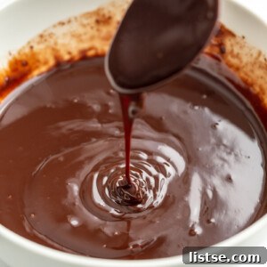 Vegan Chocolate Ganache dripping from a spoon