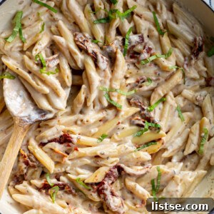 Chickpea Pasta cooked in a creamy sauce in a skillet.