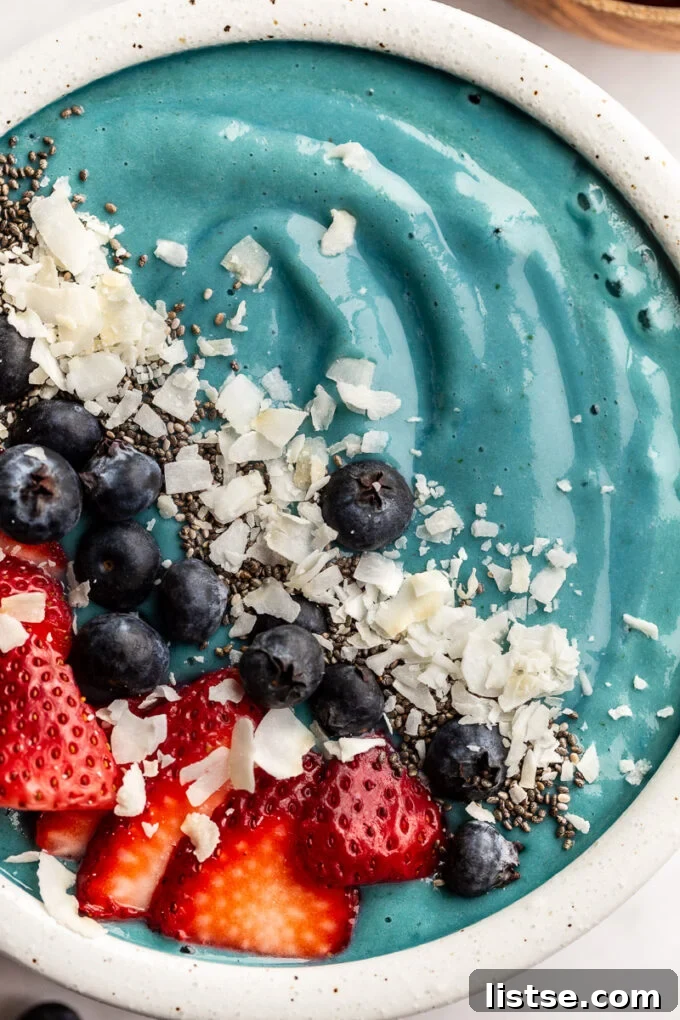 Vibrant Blue Spirulina Smoothie 3 A vibrant blue smoothie bowl made with nutrient-rich blue spirulina powder, ready for toppings.