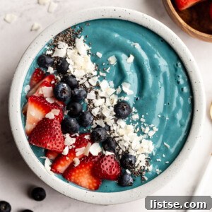 Vibrant Blue Spirulina Smoothie 6 Blue Spirulina Smoothie bowl topped with fresh fruit.