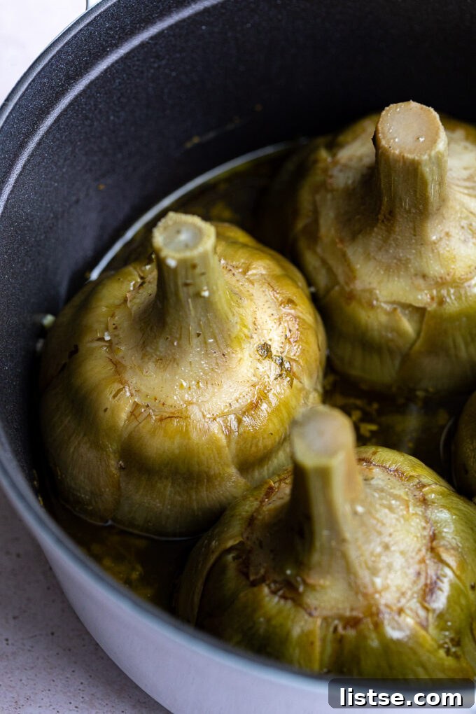 Exquisitely prepared Roman Artichokes, tender and flavorful, garnished with fresh herbs