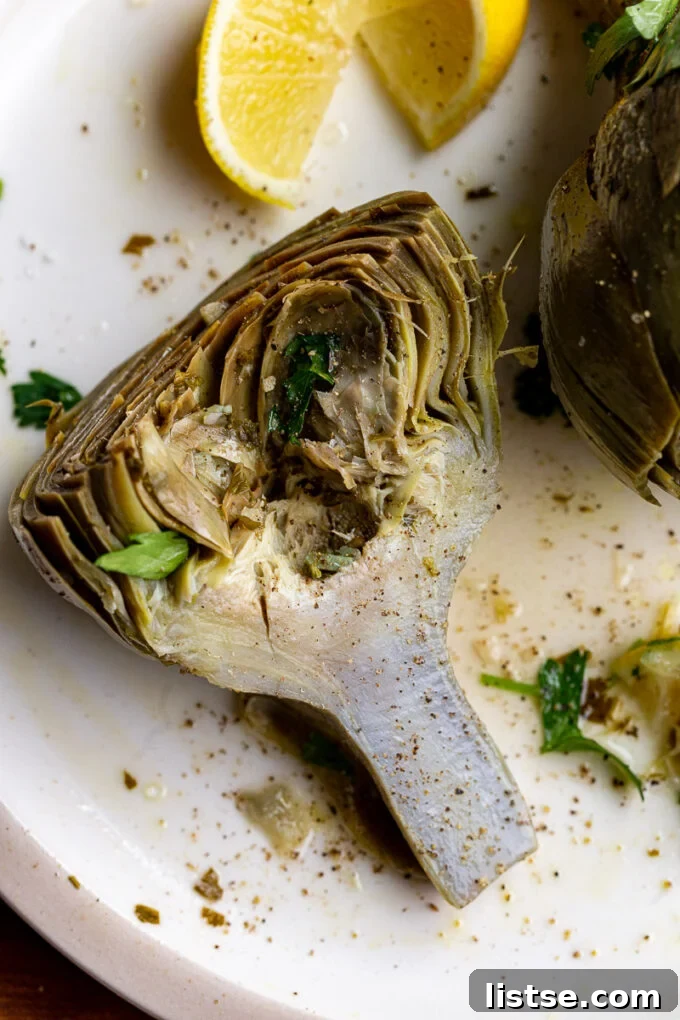 A serving of tender Roman Artichokes on a ceramic plate, highlighting their delicious interior