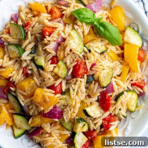 Orzo pasta salad with roasted veggies mixed in.