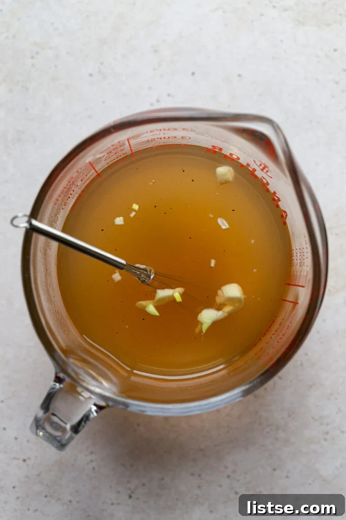 Mixing brine in a glass measuring cup.