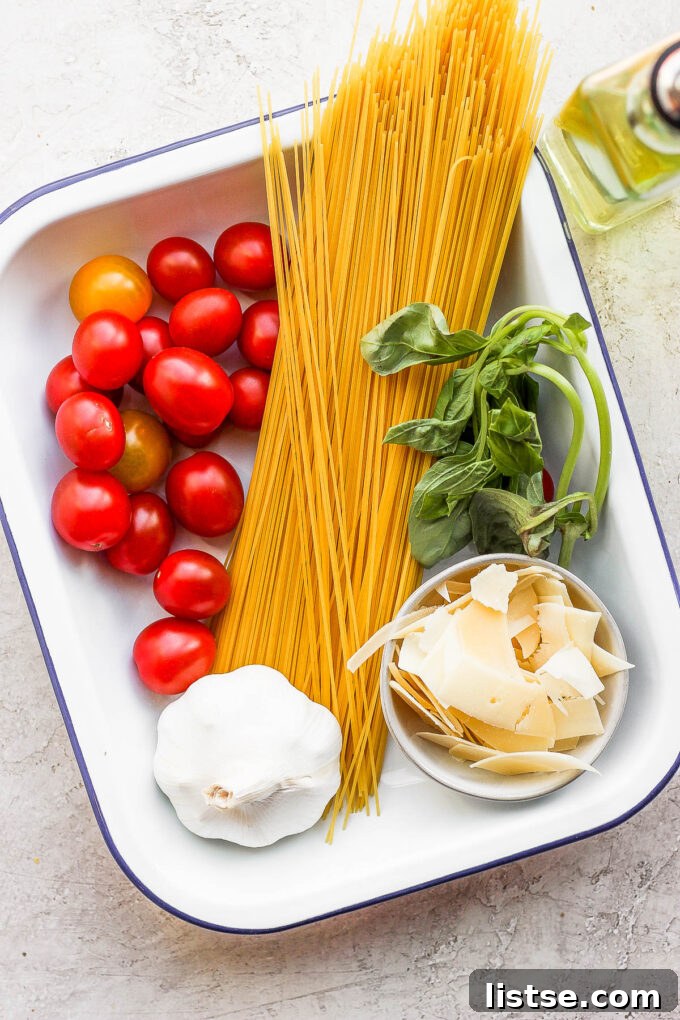 Individual ingredients for spaghetti, including pasta, tomatoes, basil, and olive oil, laid out in a white bowl and on a cutting board.