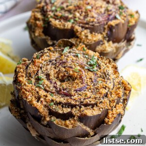 A close-up of a beautifully prepared stuffed purple artichoke, showcasing its vibrant color and tempting filling.