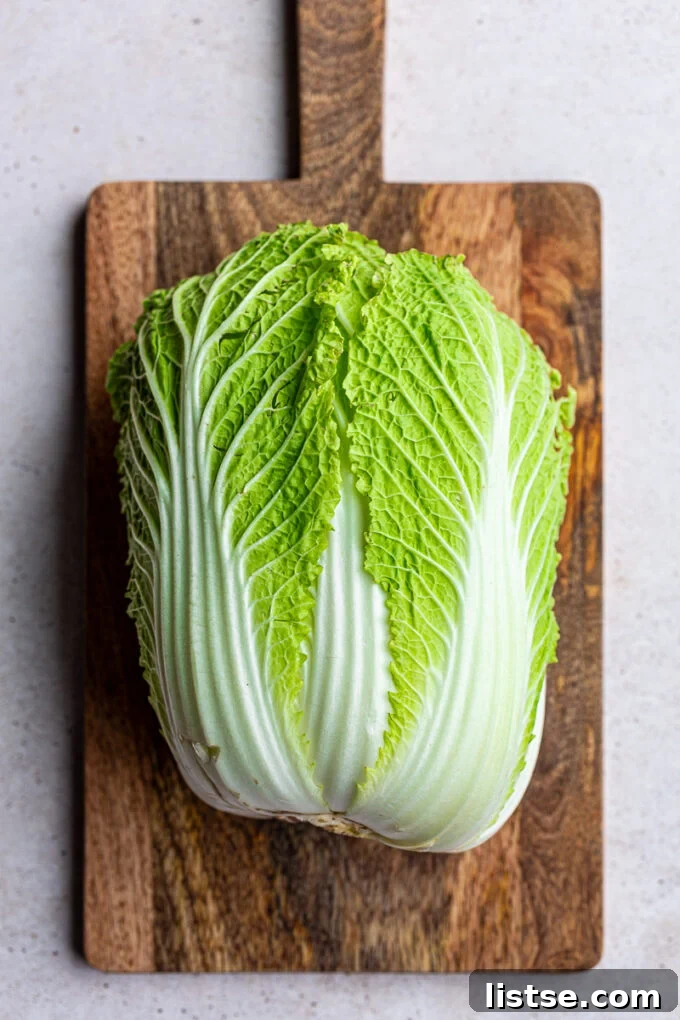 Golden Napa Cabbage Sauté 3 Fresh Napa cabbage on a cutting board.
