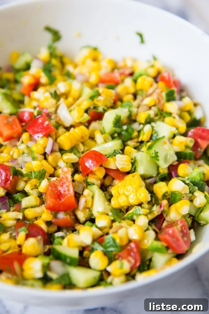 Sizzling Vegetarian Grills 14 A fresh and colorful grilled corn salad served in a elegant white serving bowl, perfect for summer gatherings.