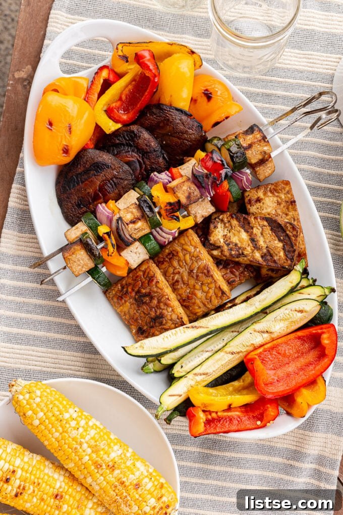 Sizzling Vegetarian Grills 5 A vibrant platter of grilled vegetables and vegetarian kebabs, ready to be served at a summer gathering.