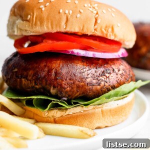 Portobello mushroom burger served with French fries.