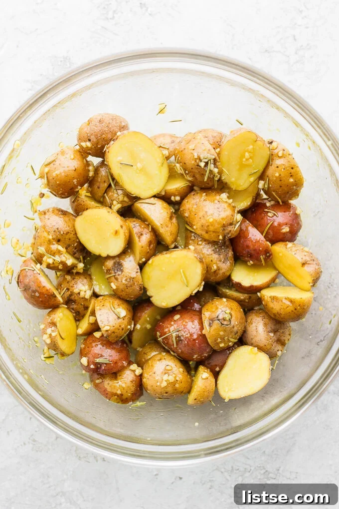 Golden Roasted Potatoes with Tender-Crisp Green Beans 3 Seasoning chopped potatoes in a large mixing bowl.