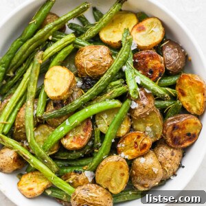 Roasted Potatoes and Green Beans in a white serving bowl.