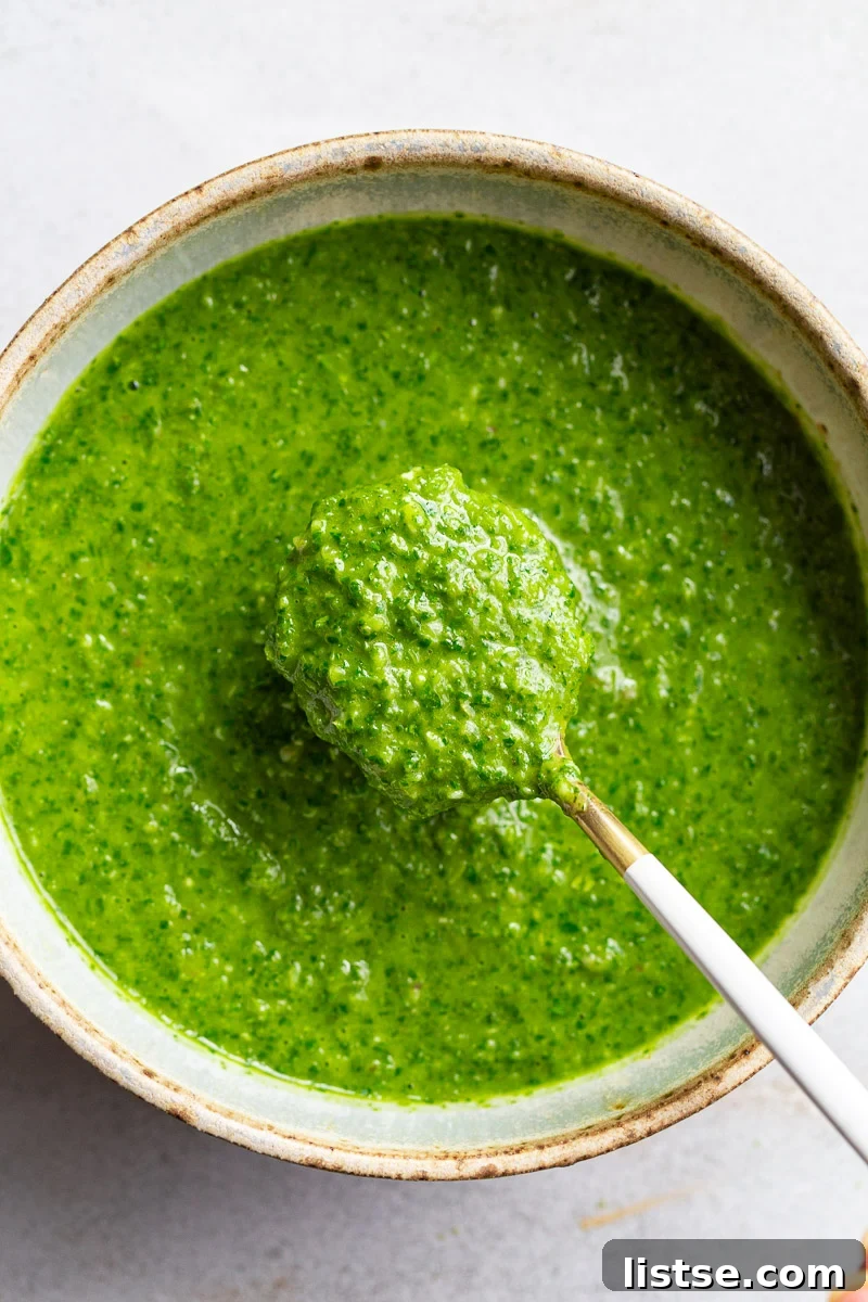 Zesty Argentine Chimichurri 2 Freshly made Chimichurri Sauce served in a small green bowl, ready to be drizzled.