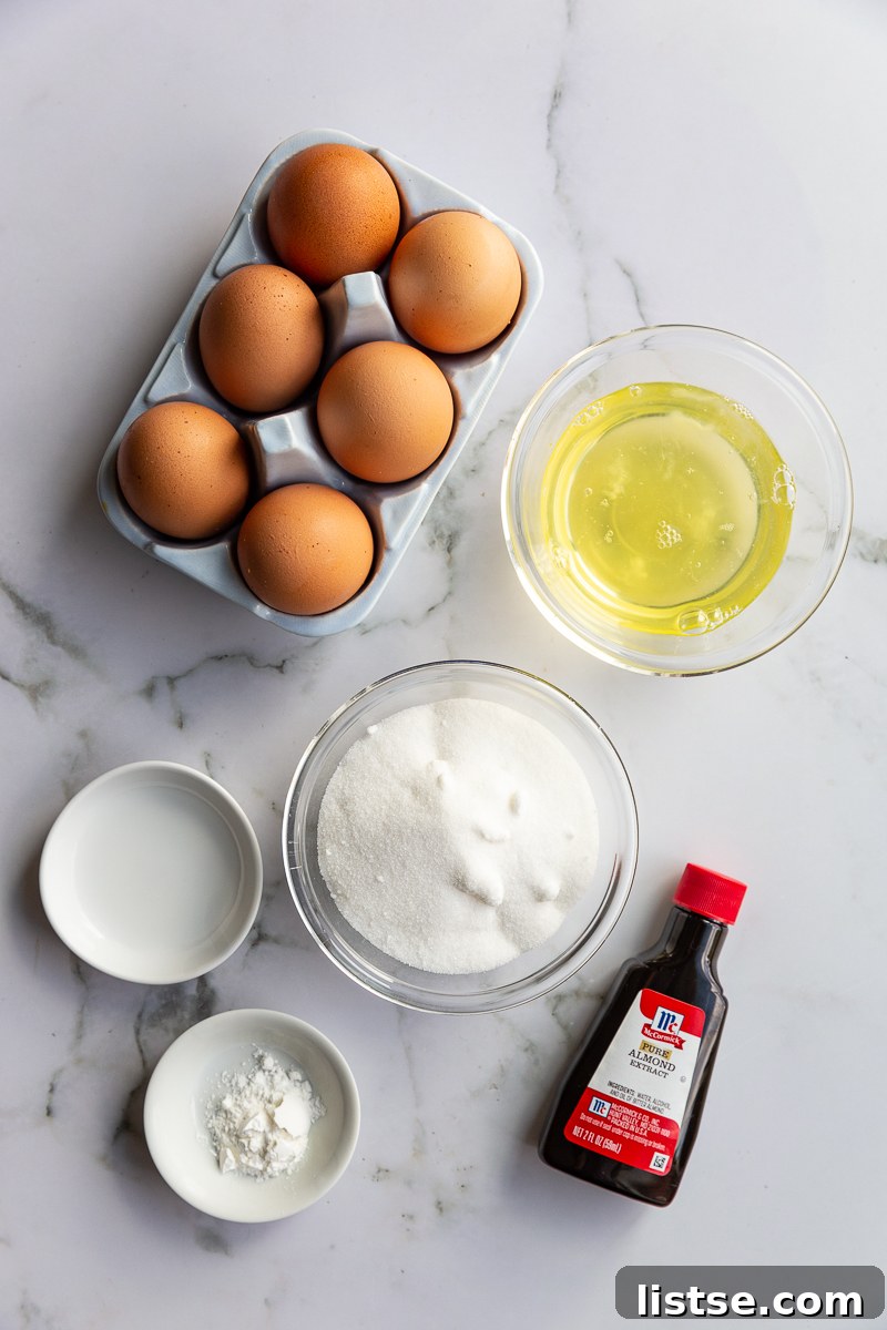 Fresh ingredients for making Pavlova, including eggs, sugar, and berries