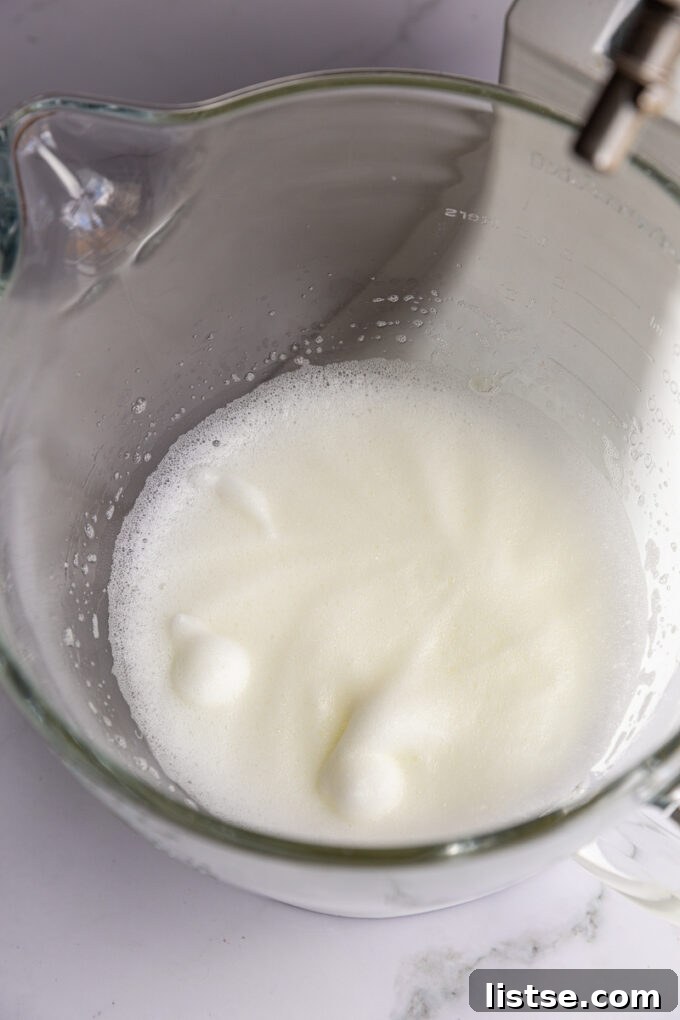 Step 1: Whipping egg whites until frothy