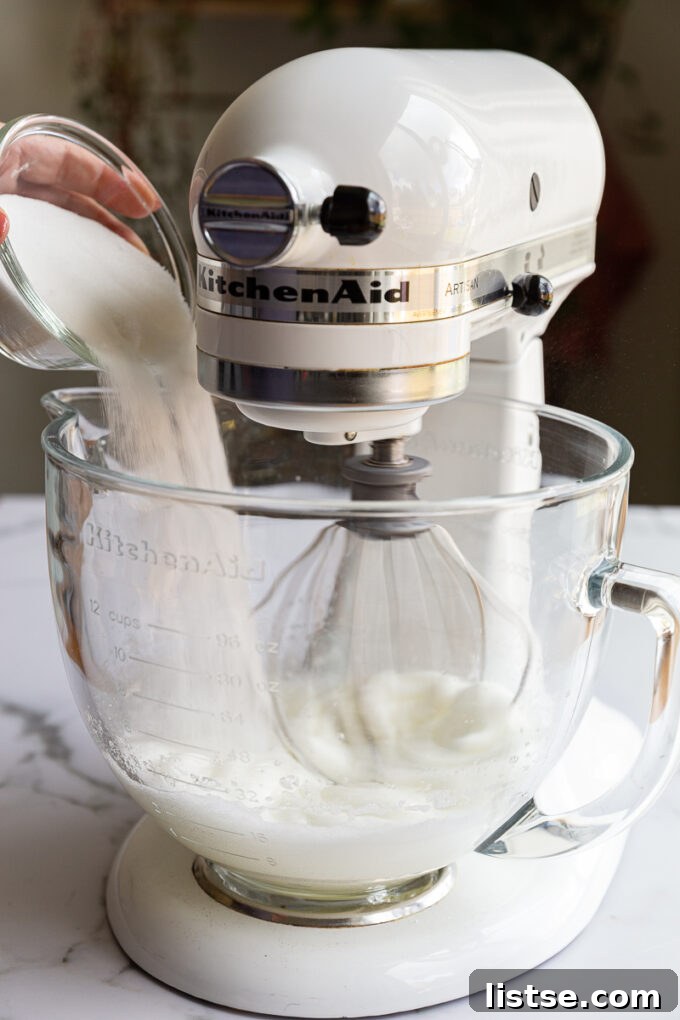 Step 2: Gradually adding sugar to egg whites