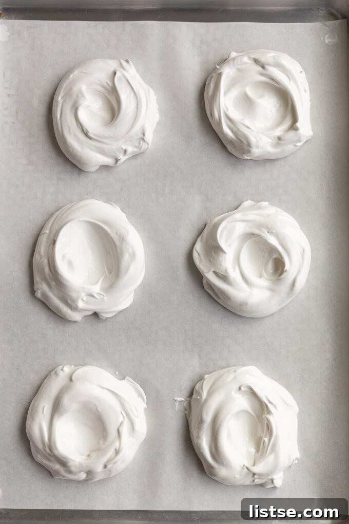 Baked Pavlova shells cooling in the oven