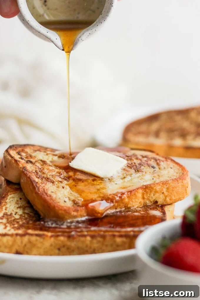Drizzling syrup over French toast slices.