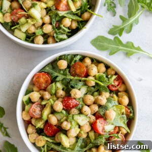 Chickpea avocado salad served in a small white bowl.