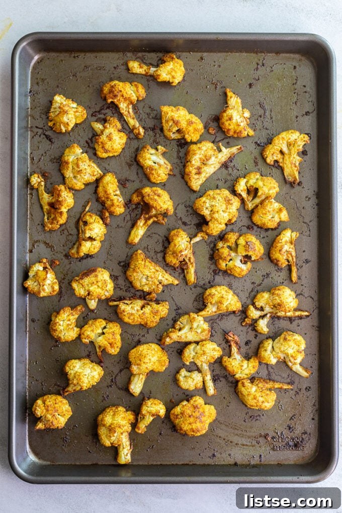 Roasting cauliflower on a sheet pan in a single layer.