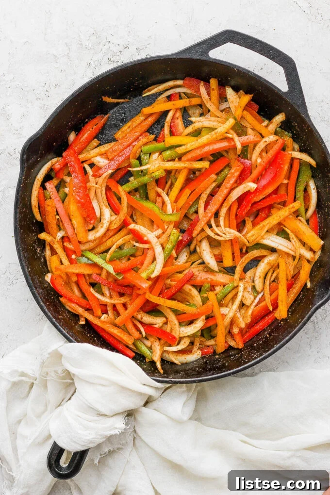 Sautéing fajita veggies in a hot skillet.