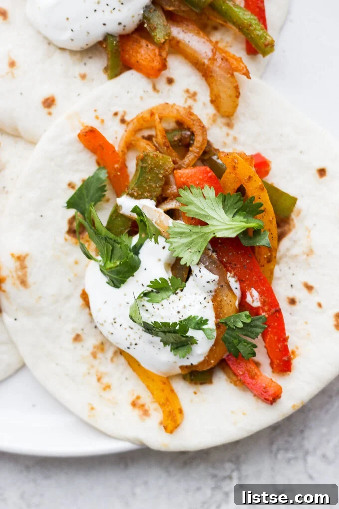 Sautéed bell peppers served on flour tortillas.