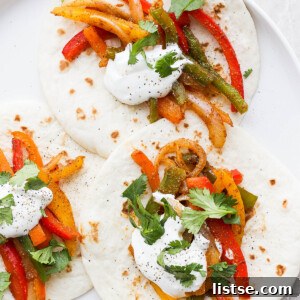 Fajitas made with flour tortillas, veggies, sour cream and cilantro.
