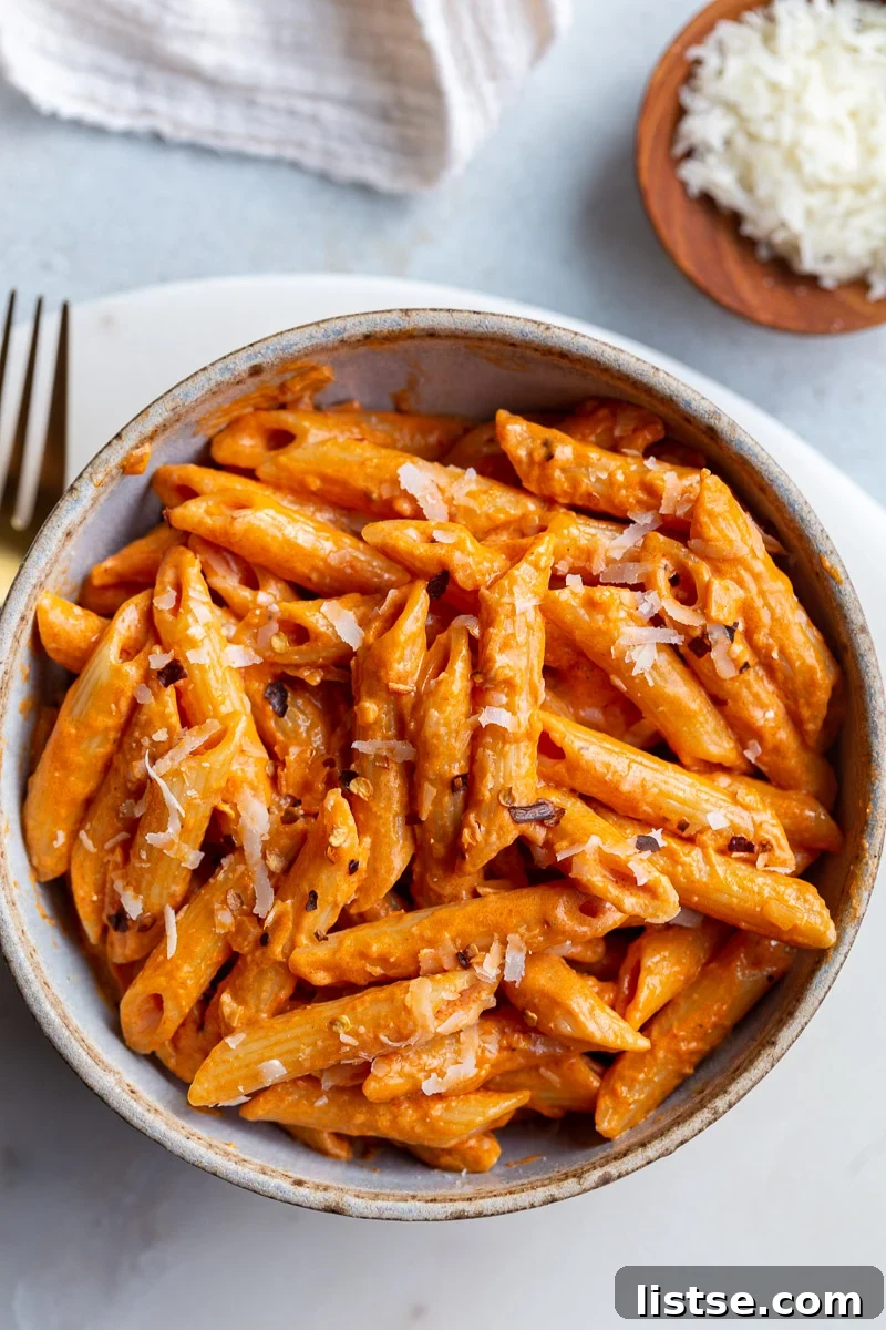 Penne pasta in a tomato sauce served in a bowl.