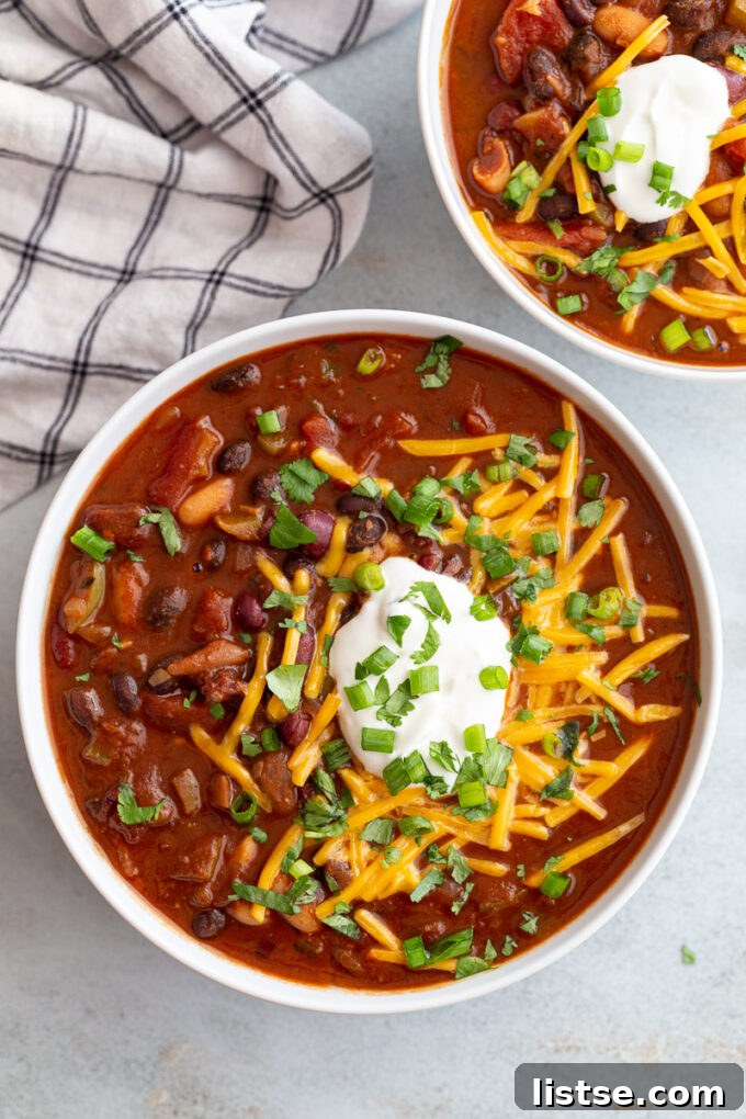 Ultimate Instant Pot Chili 2 Instant pot chili topped with shredded cheese, sour cream and green onions.