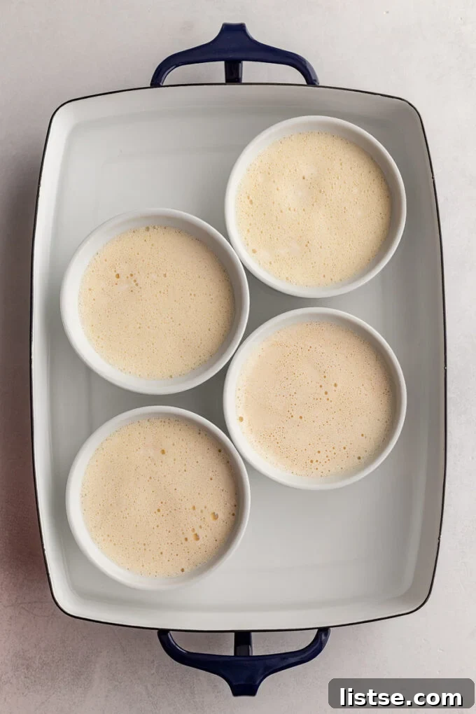 Crème Brûlée mixture in small bowls before baking, showing its smooth consistency.