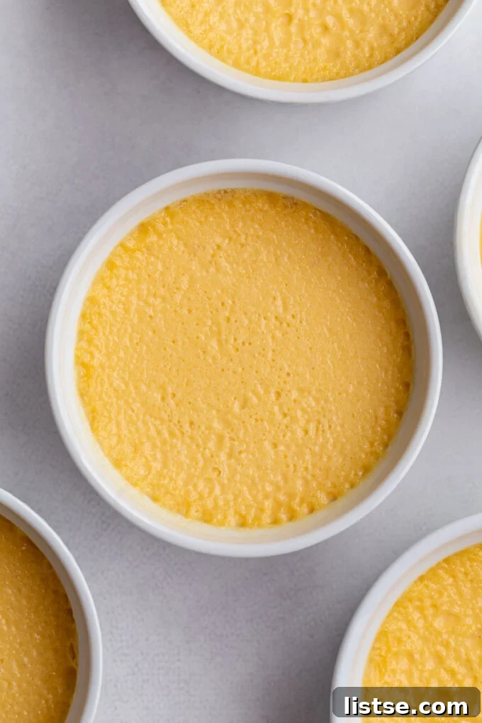 Baked Crème Brûlée in a ramekin, showcasing its perfectly set texture.