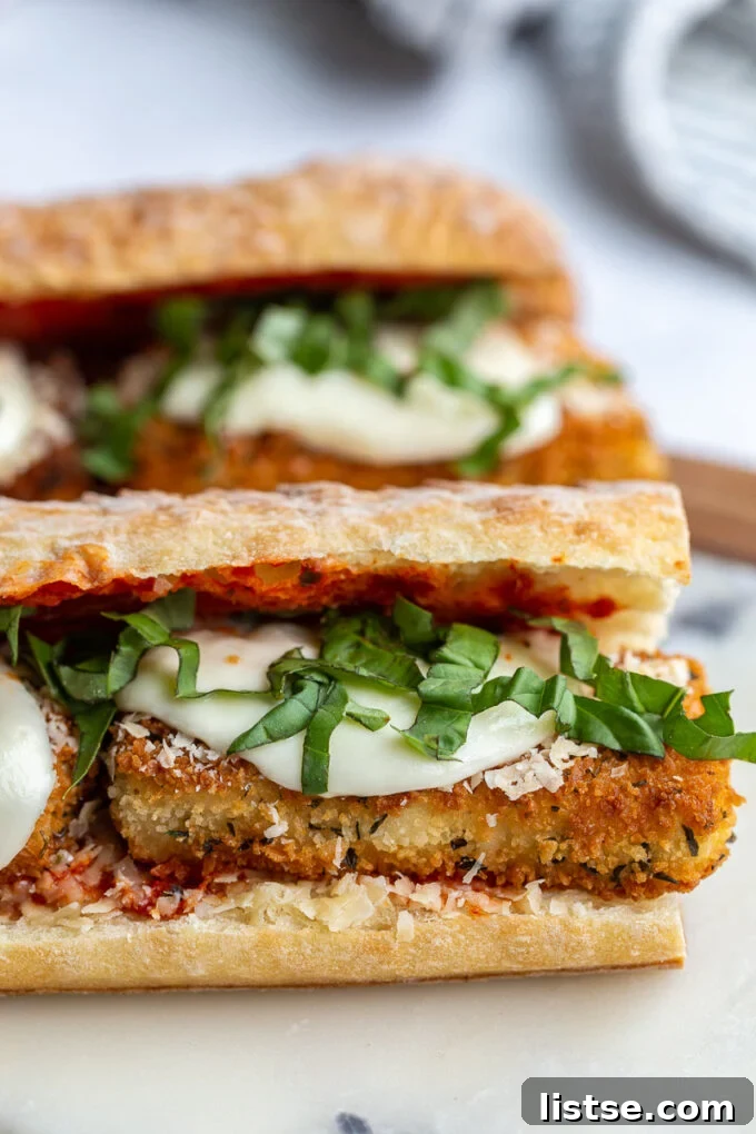 Sandwich with fried tofu, marinara, cheese and fresh basil.