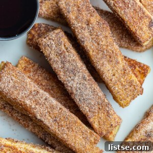 French toast sticks served with maple syrup.