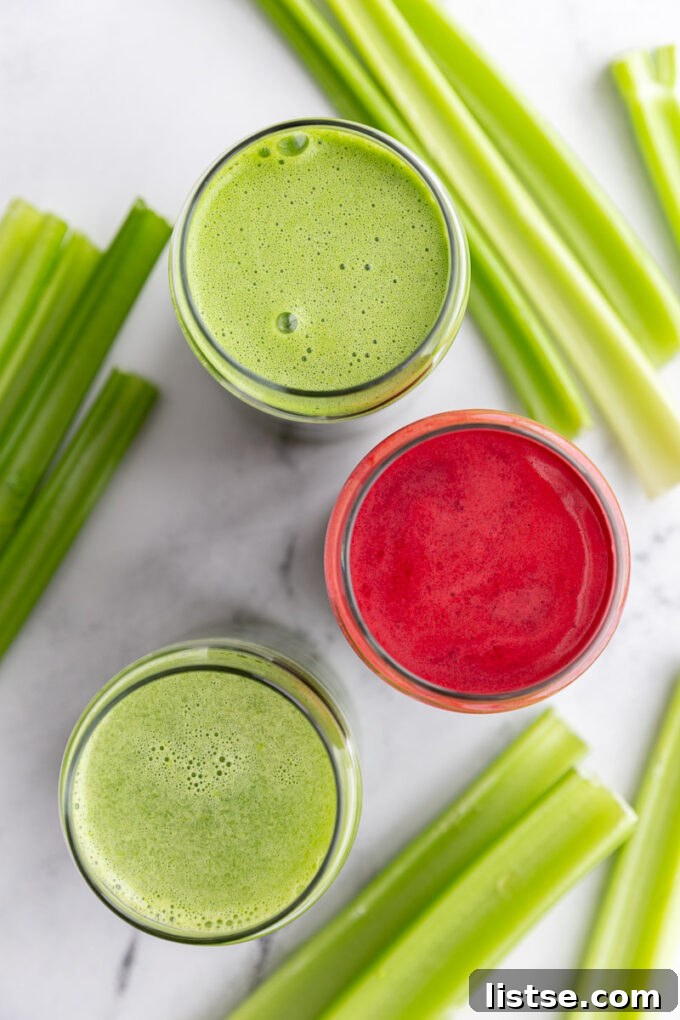 Freshly made green celery juice in a glass, garnished with a celery stalk.