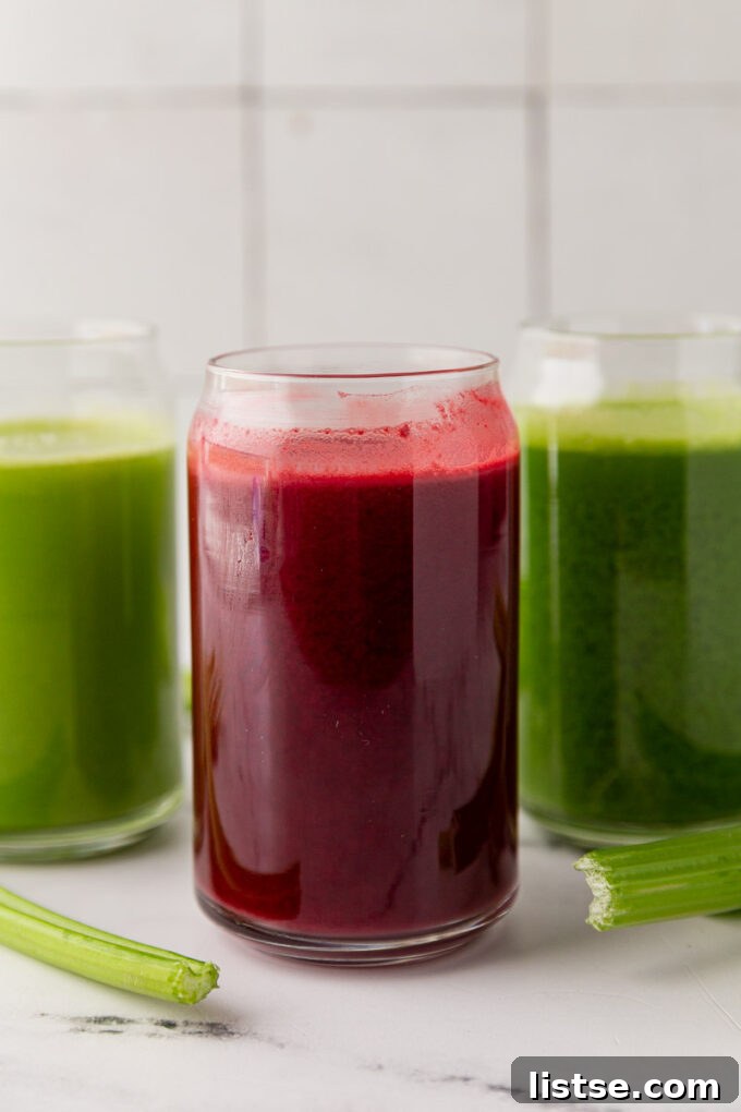 Three different glasses of celery juice: plain green, darker green, and reddish-purple beet blend.