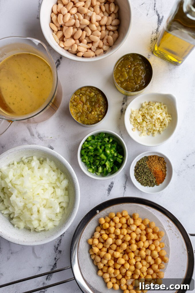 Ingredients needed to make chickpea chili divided into small bowls.