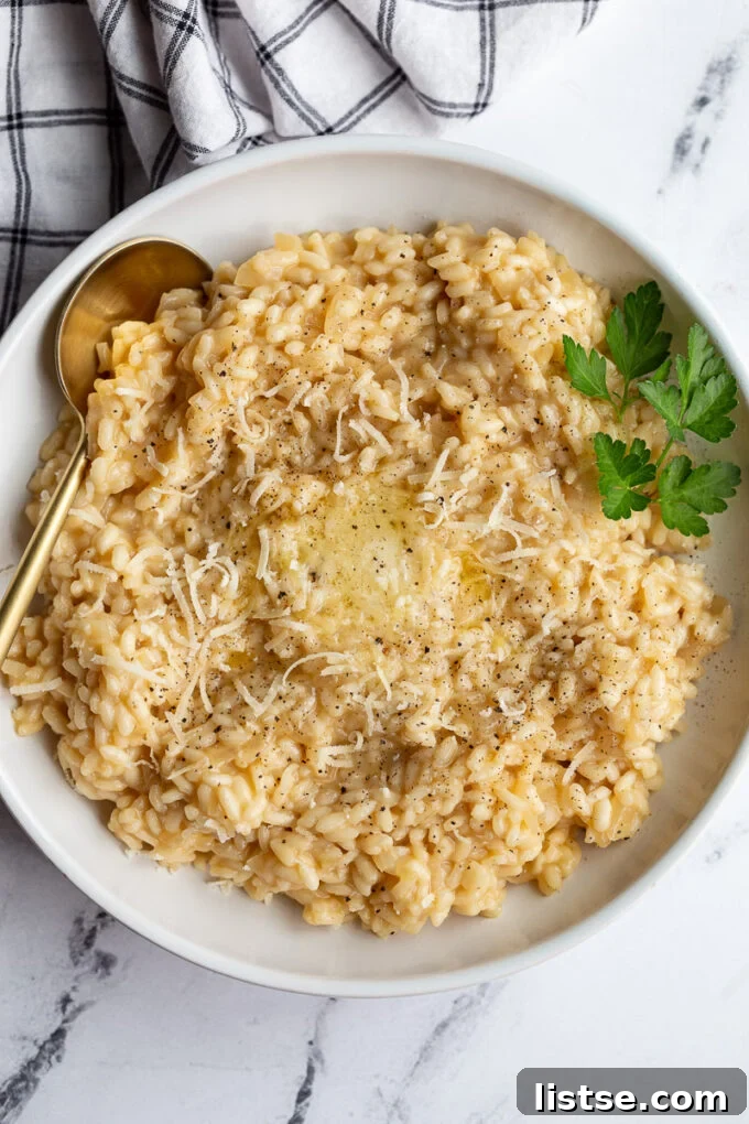 Crafting Perfect Risotto 2 Creamy homemade risotto in a white bowl, garnished with fresh parsley.
