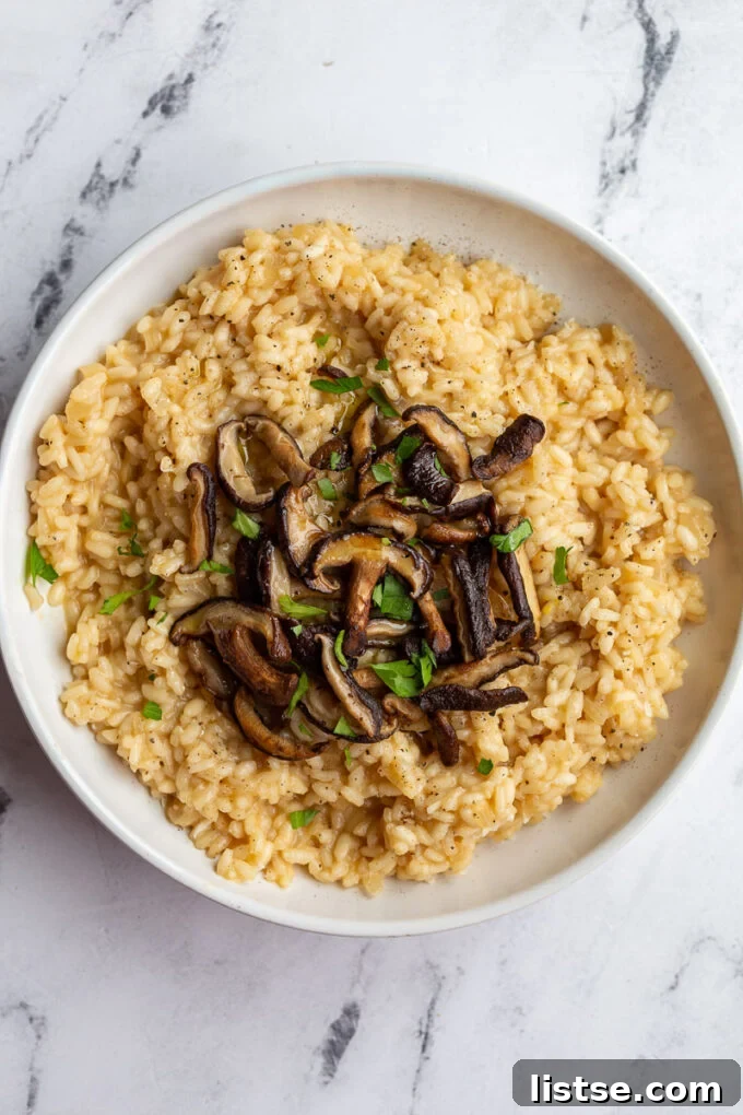Crafting Perfect Risotto 7 Creamy risotto topped with perfectly sautéed mushrooms.