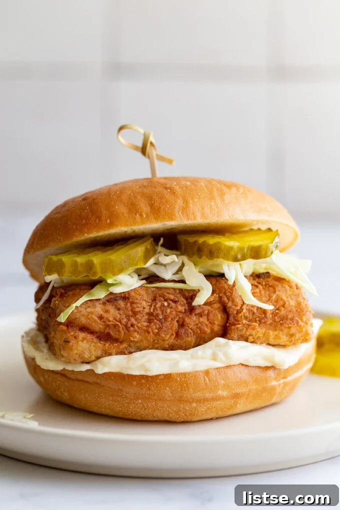 Southern Fried Tofu Sandwich 2 Crispy Vegan 'Chicken' Sandwich made from tofu, served on a bun with fresh toppings.
