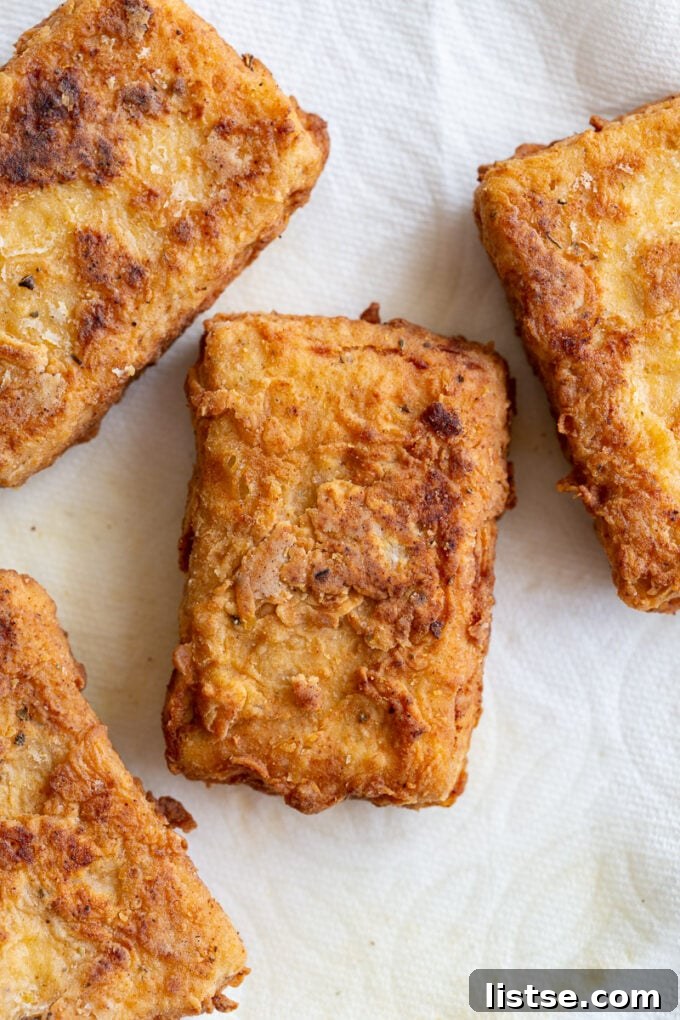 Southern Fried Tofu Sandwich 3 Perfectly breaded and fried tofu 'chicken' fillets, golden brown and ready for assembly.