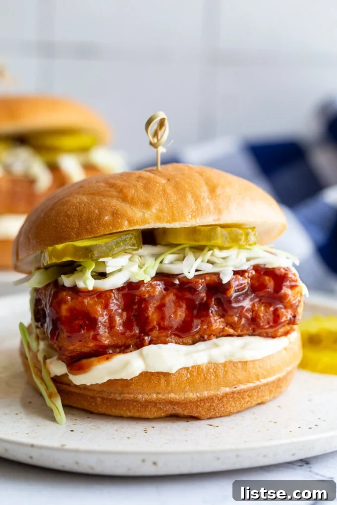 Southern Fried Tofu Sandwich 4 Delicious vegan 'chicken' BBQ sandwich on a bun with vegan mayonnaise, crisp cabbage, and tangy pickles.
