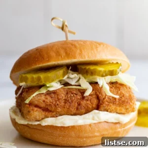Crispy Vegan 'Chicken' Sandwich made from tofu, served on a bun with fresh toppings.