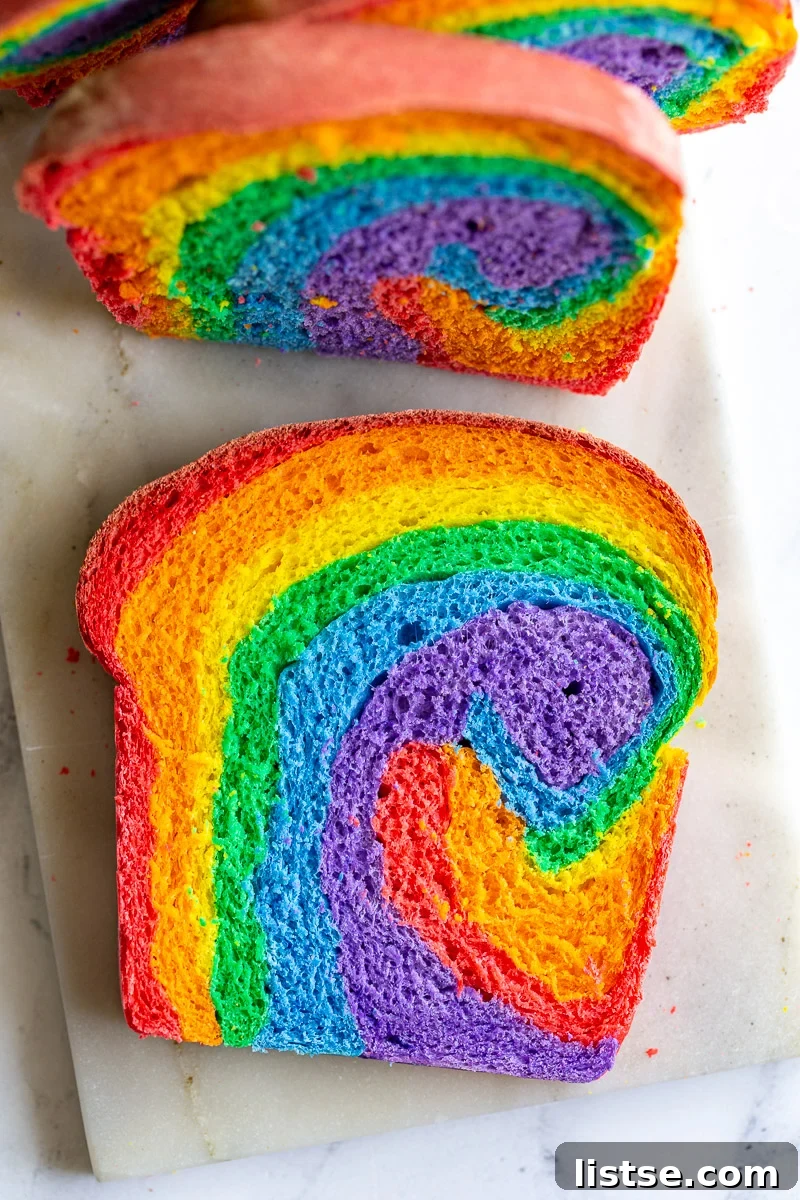 Kaleidoscope Loaf 2 A vibrant loaf of Rainbow Bread, showing a beautiful swirl of colors when sliced.