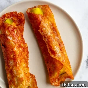 pickle in a blanket: pickle spear wrapped in crispy cheese